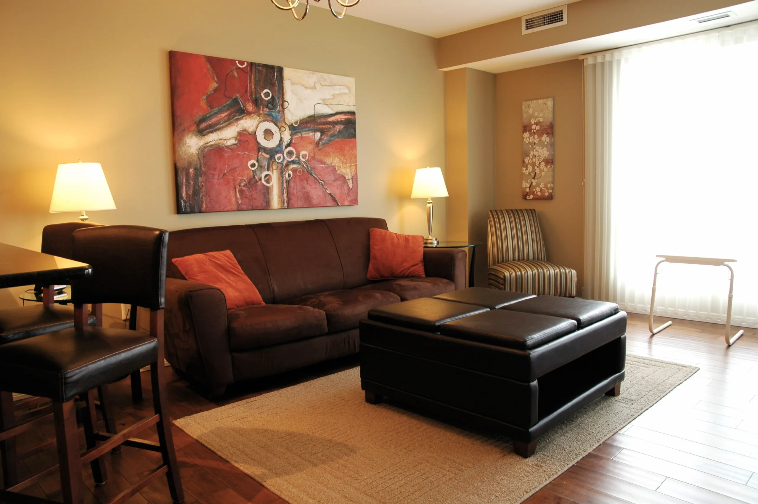 Living room at 1-bedroom furnished extended stay rental suite in Saskatoon, SK