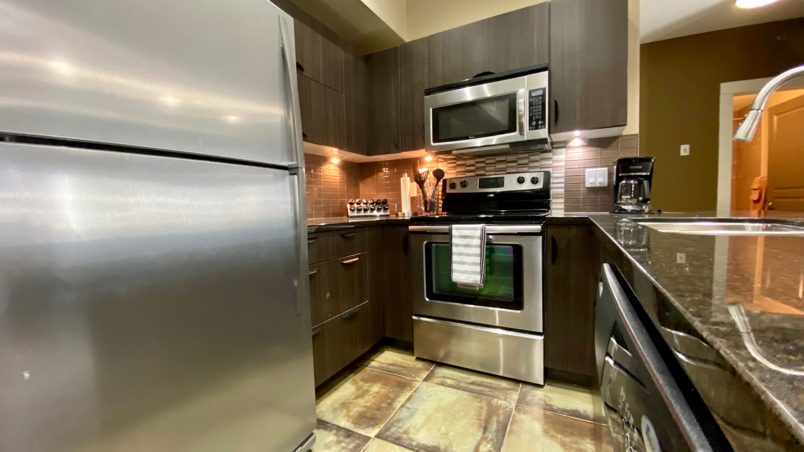 TV I executive condo rental Fully supplied kitchen in 2-bed/2-bath furnished monthly condo rental in Saskatoon
