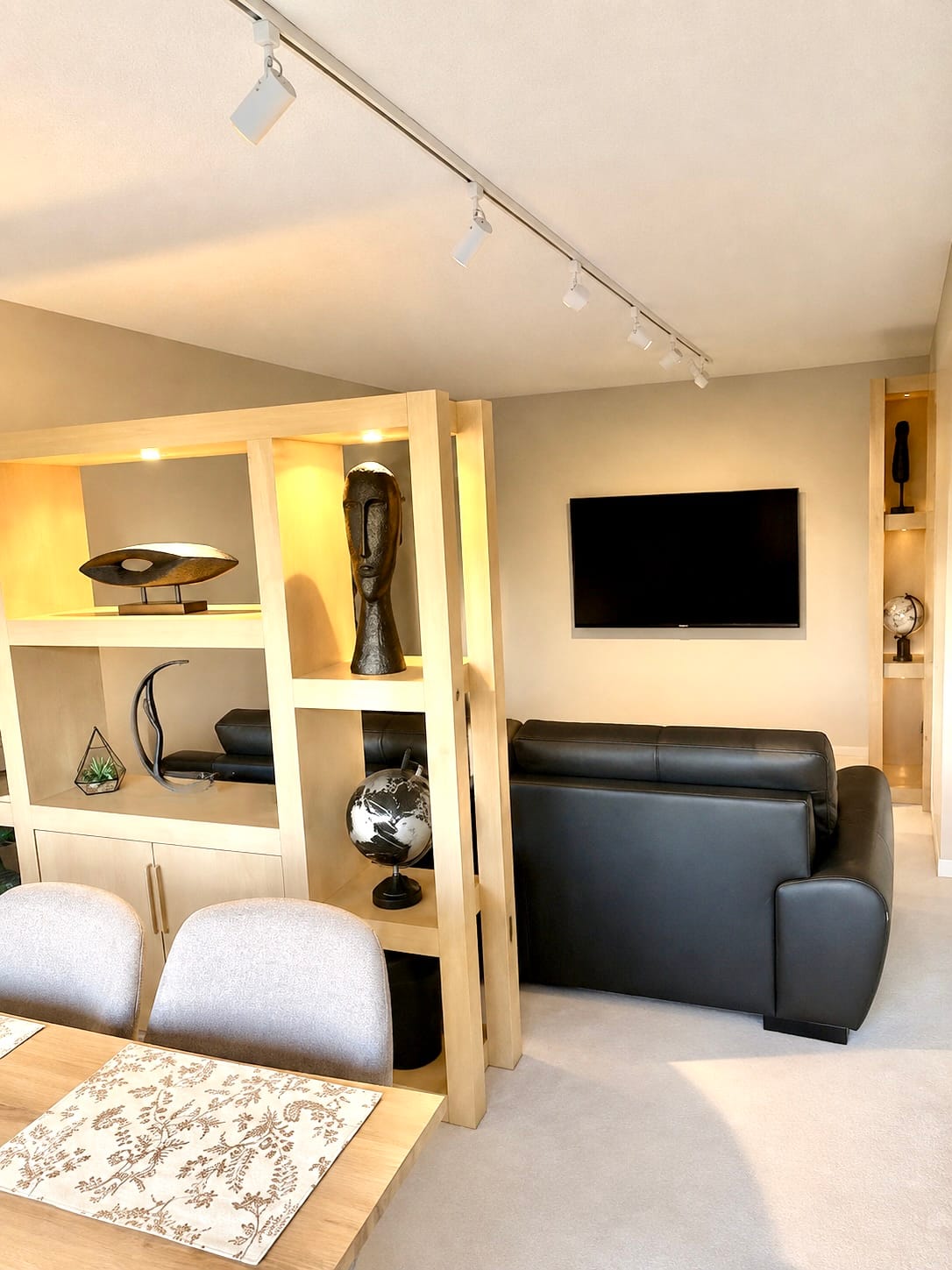 Living room with Smart TV in The Renaissance, a 1-Bedroom/1.5-Bathroom Furnished Rental for Extended Stays in Saskatoon.